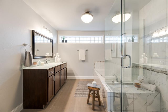 bathroom featuring vanity, wood-type flooring, and independent shower and bath