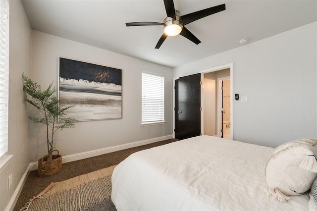 bedroom with ceiling fan and dark colored carpet