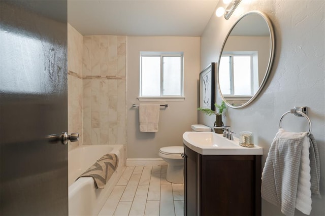 full bathroom featuring vanity, toilet, and tiled shower / bath