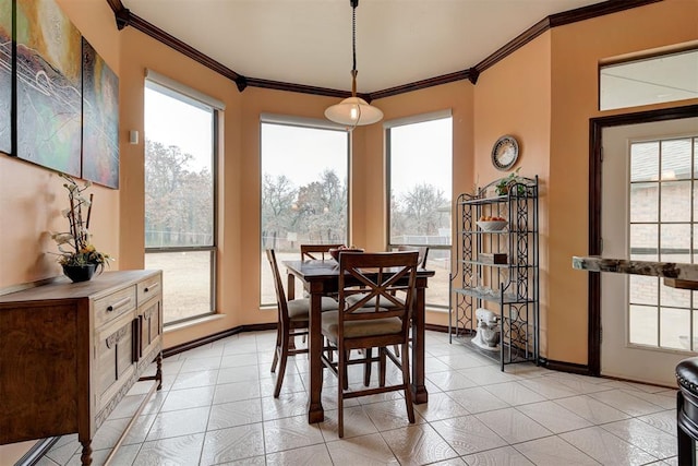 tiled dining area featuring ornamental molding