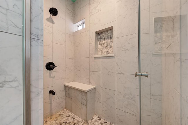 bathroom featuring a tile shower