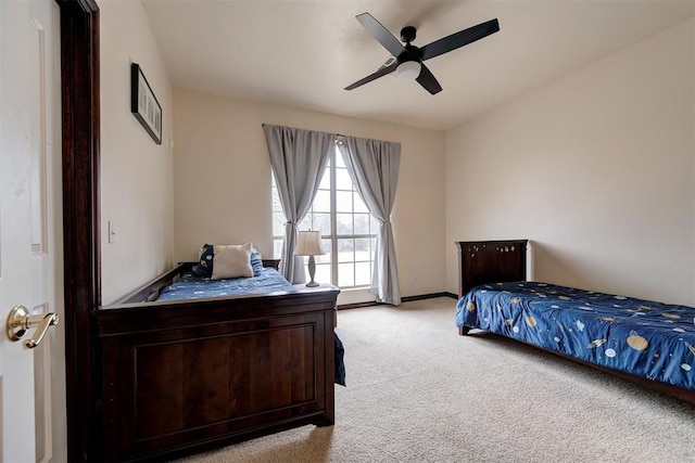 bedroom with light colored carpet and ceiling fan