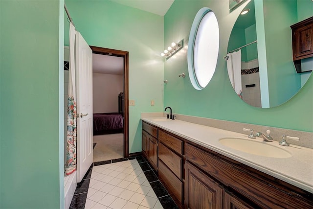 bathroom with vanity and tile patterned flooring