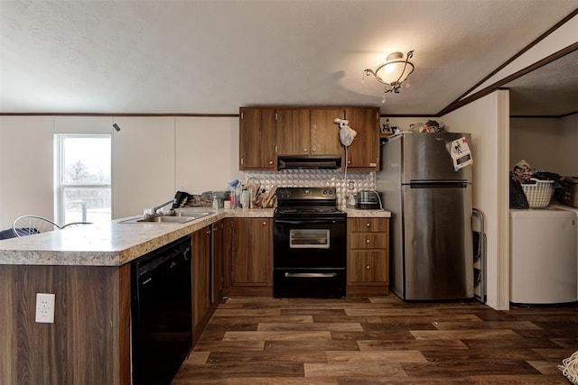 kitchen with dark hardwood / wood-style flooring, kitchen peninsula, sink, and black appliances