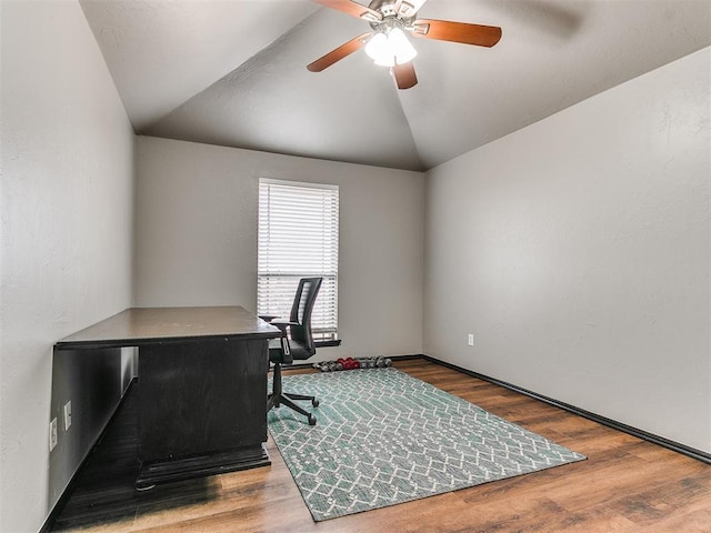 office featuring hardwood / wood-style floors, vaulted ceiling, and ceiling fan