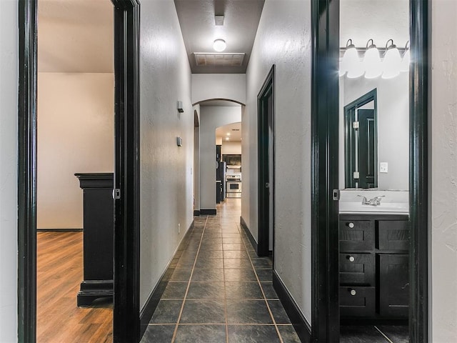 corridor with dark hardwood / wood-style floors