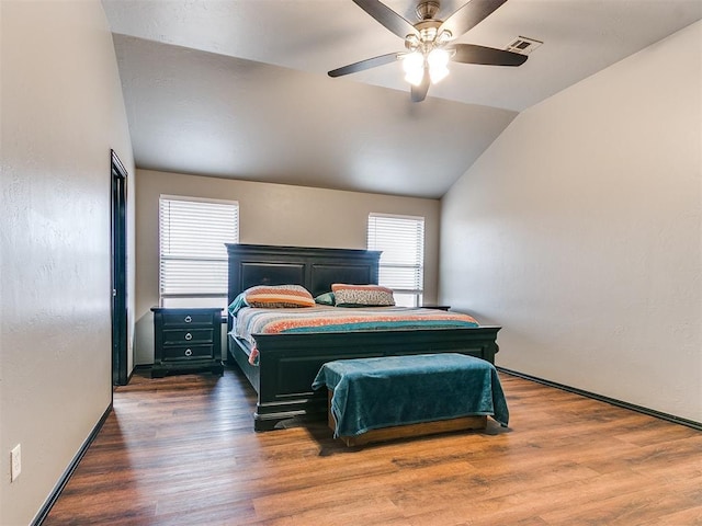 bedroom featuring vaulted ceiling, ceiling fan, and dark hardwood / wood-style flooring