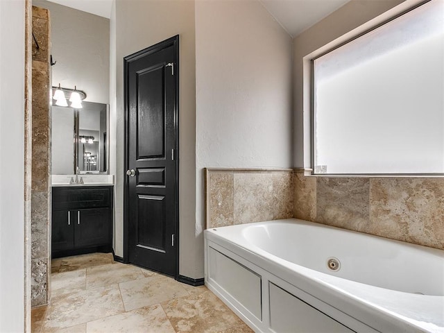 bathroom with vanity and a bathtub