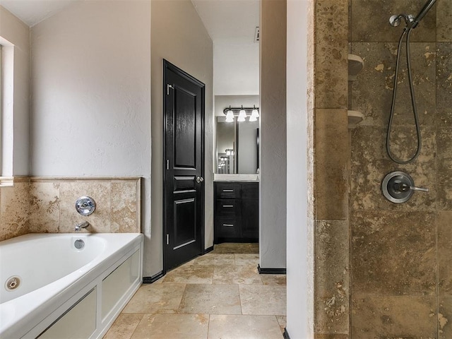 bathroom featuring shower with separate bathtub