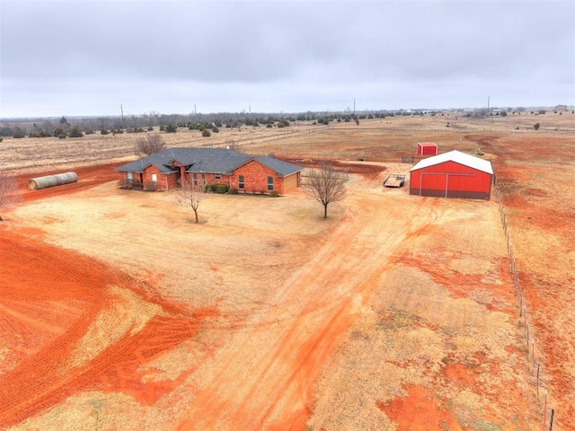 birds eye view of property featuring a rural view