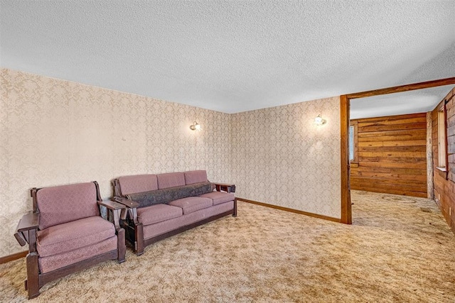 living room with light carpet and a textured ceiling