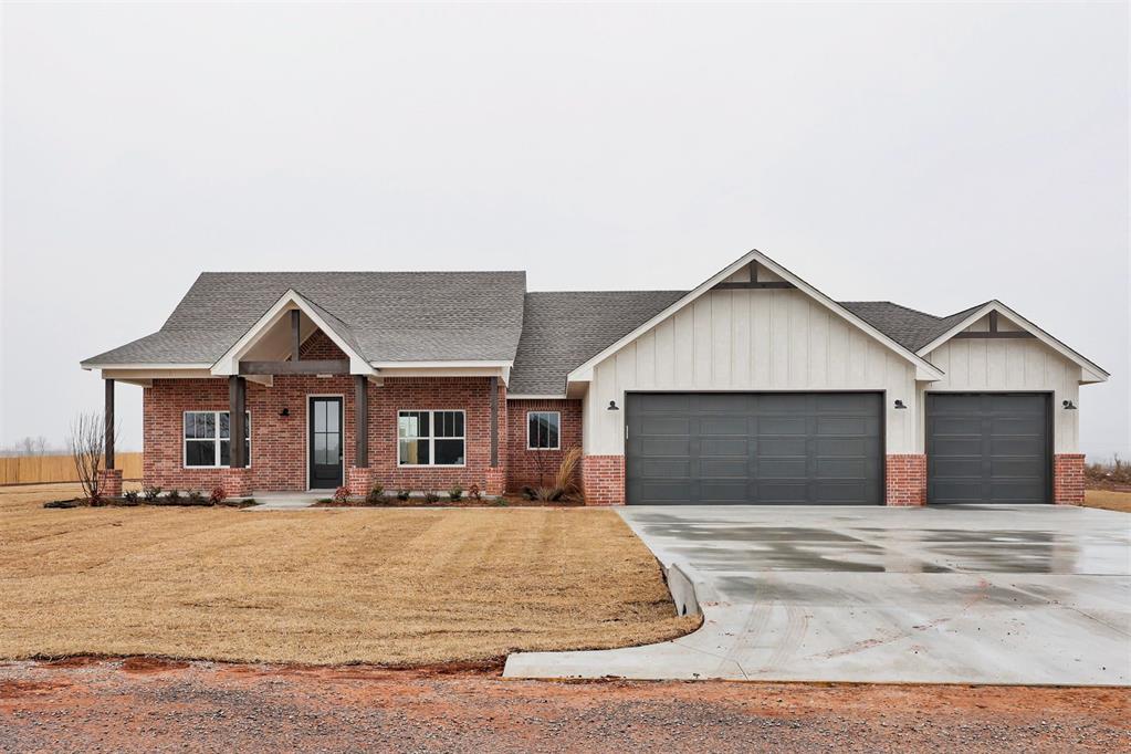 2086 Henry Ct, Blanchard, OK 73010 - view of front of home with a garage and a front yard