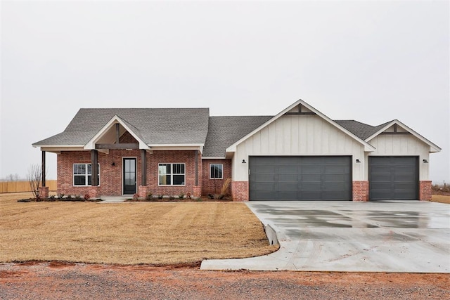 view of front of home with a garage and a front yard