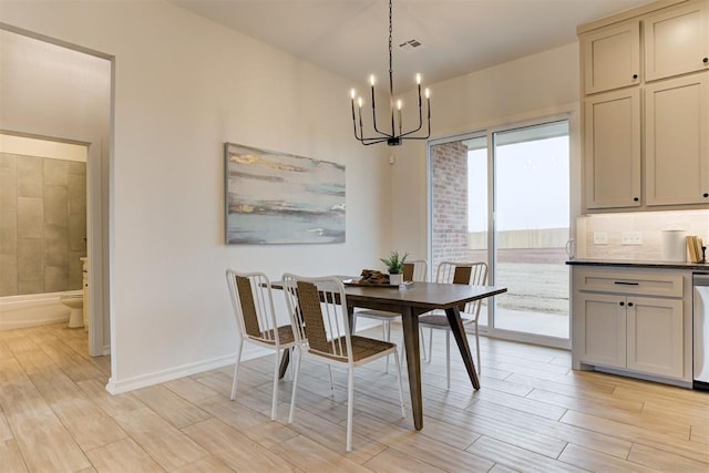 dining space featuring a chandelier