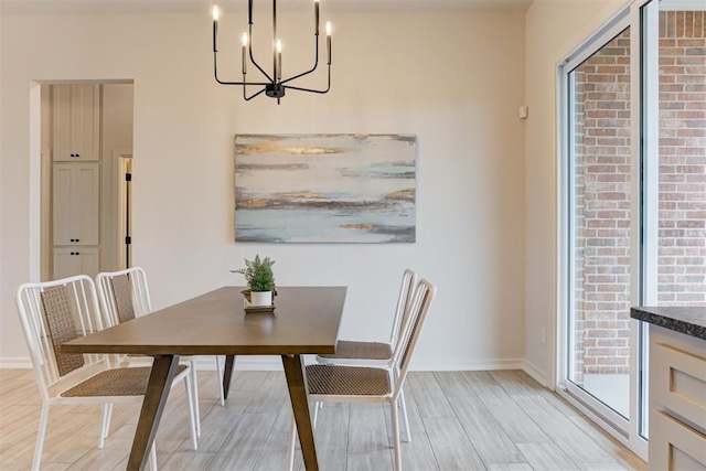 dining space with a notable chandelier