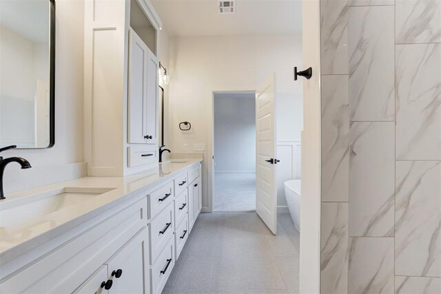 bathroom featuring vanity and a bathing tub