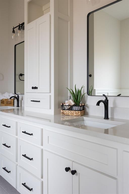 bathroom with vanity and tile patterned flooring