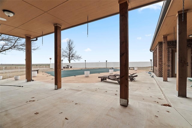 view of patio / terrace featuring a covered pool