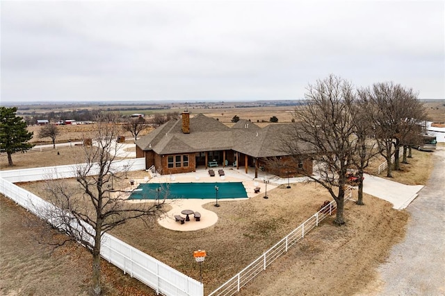 view of pool featuring a rural view and a patio area