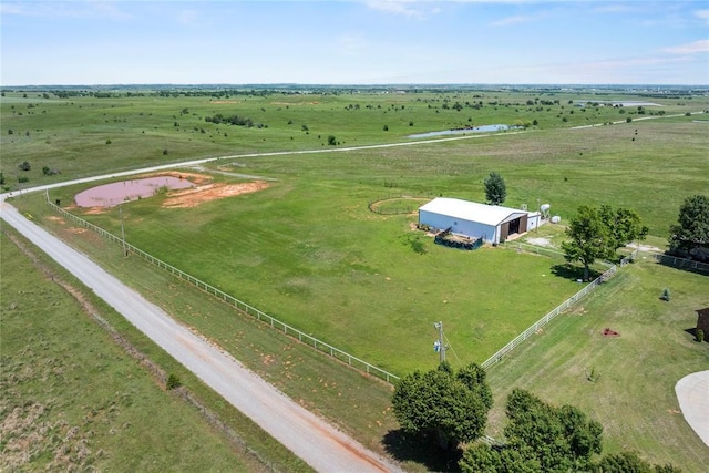 aerial view of sparsely populated area featuring a pastoral area