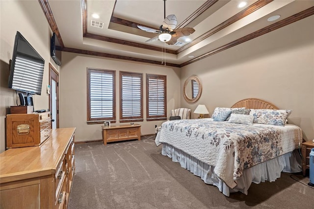 carpeted bedroom featuring crown molding, baseboards, a ceiling fan, a raised ceiling, and recessed lighting