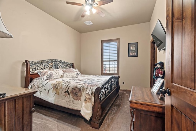 bedroom with dark carpet and ceiling fan