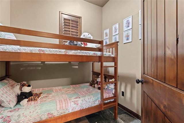 bedroom featuring baseboards