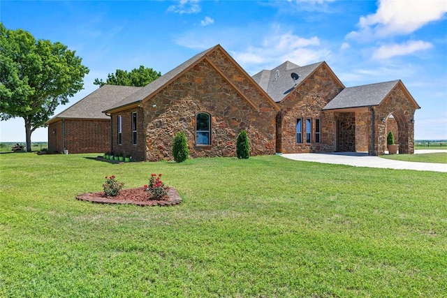 view of front of property featuring a front yard and stone siding