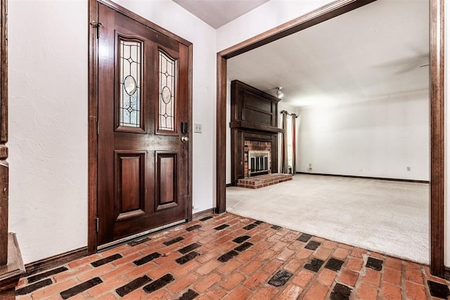 entryway with a fireplace