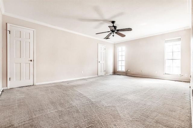 unfurnished room featuring crown molding, carpet flooring, and ceiling fan