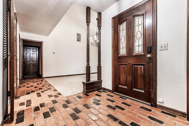 foyer featuring a chandelier