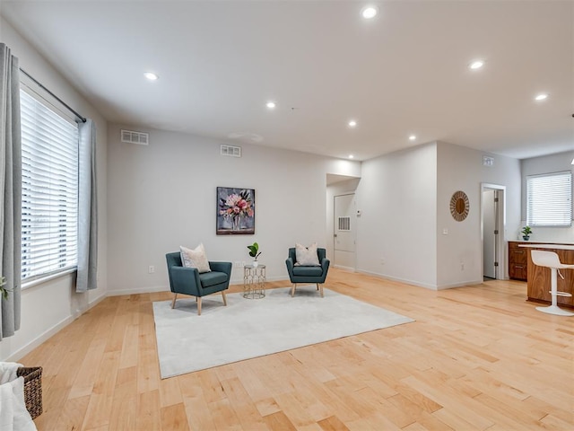 sitting room featuring light hardwood / wood-style flooring