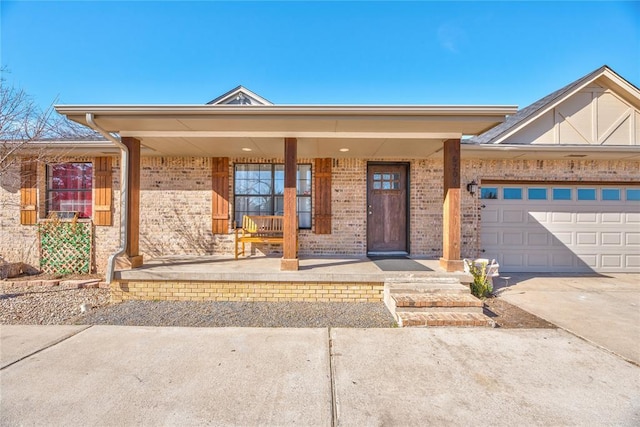 view of front of house featuring a porch and a garage