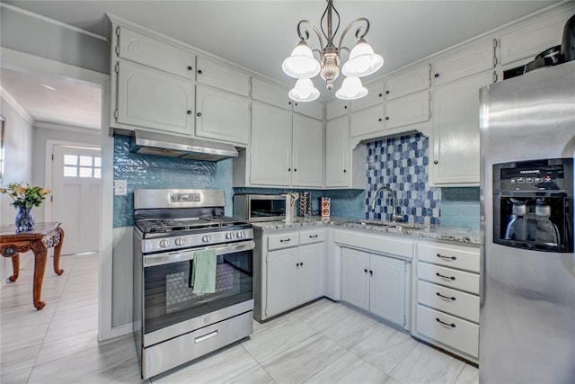 kitchen featuring sink, tasteful backsplash, hanging light fixtures, stainless steel appliances, and range hood