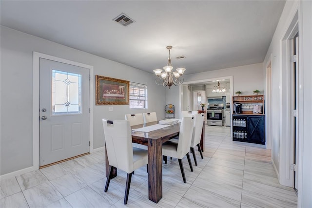 dining area with a chandelier