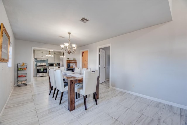 dining room with an inviting chandelier