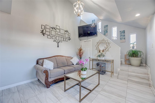 living room with a chandelier and high vaulted ceiling