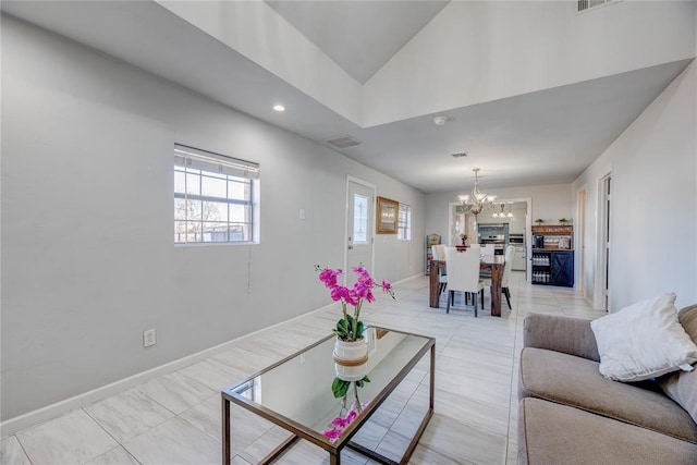 living room featuring an inviting chandelier