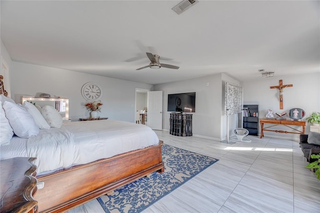 bedroom with ceiling fan and tile patterned floors