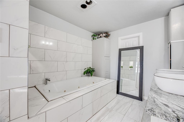 bathroom featuring tiled tub