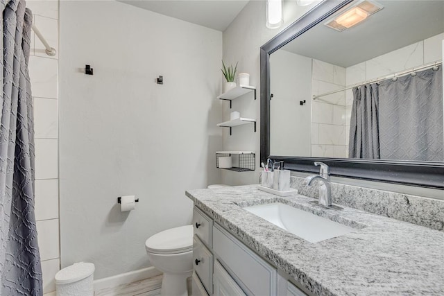 bathroom with vanity, toilet, a shower with shower curtain, and hardwood / wood-style floors