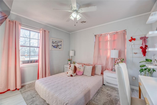 bedroom with ornamental molding, ceiling fan, and light wood-type flooring