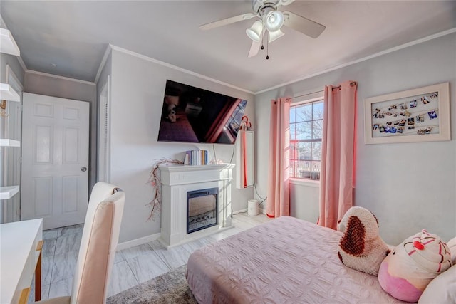 bedroom with ornamental molding and ceiling fan