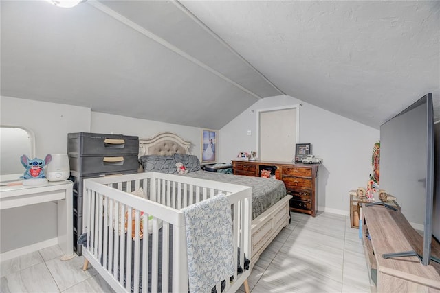 bedroom with vaulted ceiling