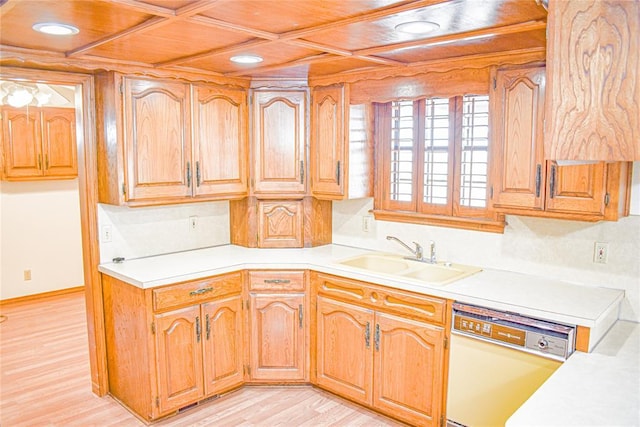 kitchen featuring light hardwood / wood-style floors, coffered ceiling, dishwasher, and sink