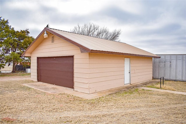 garage with a yard