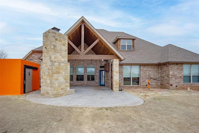 back of property with a patio area