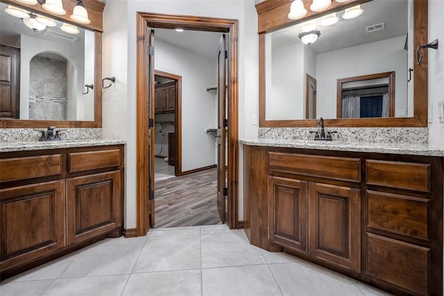 bathroom featuring vanity and tile patterned flooring