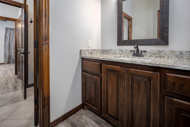 bathroom with vanity and hardwood / wood-style floors