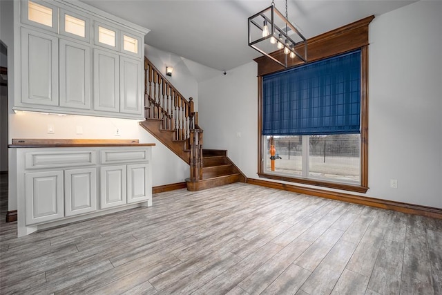 unfurnished living room with light hardwood / wood-style floors